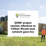 White text box with Triple Point Heat Networks Investment Management Logo and text reading 'GHNF project reaches milestone as Chilton Woods heat network goes live' overlayed on an image of the heat network with a person in a high-visibility uniform.